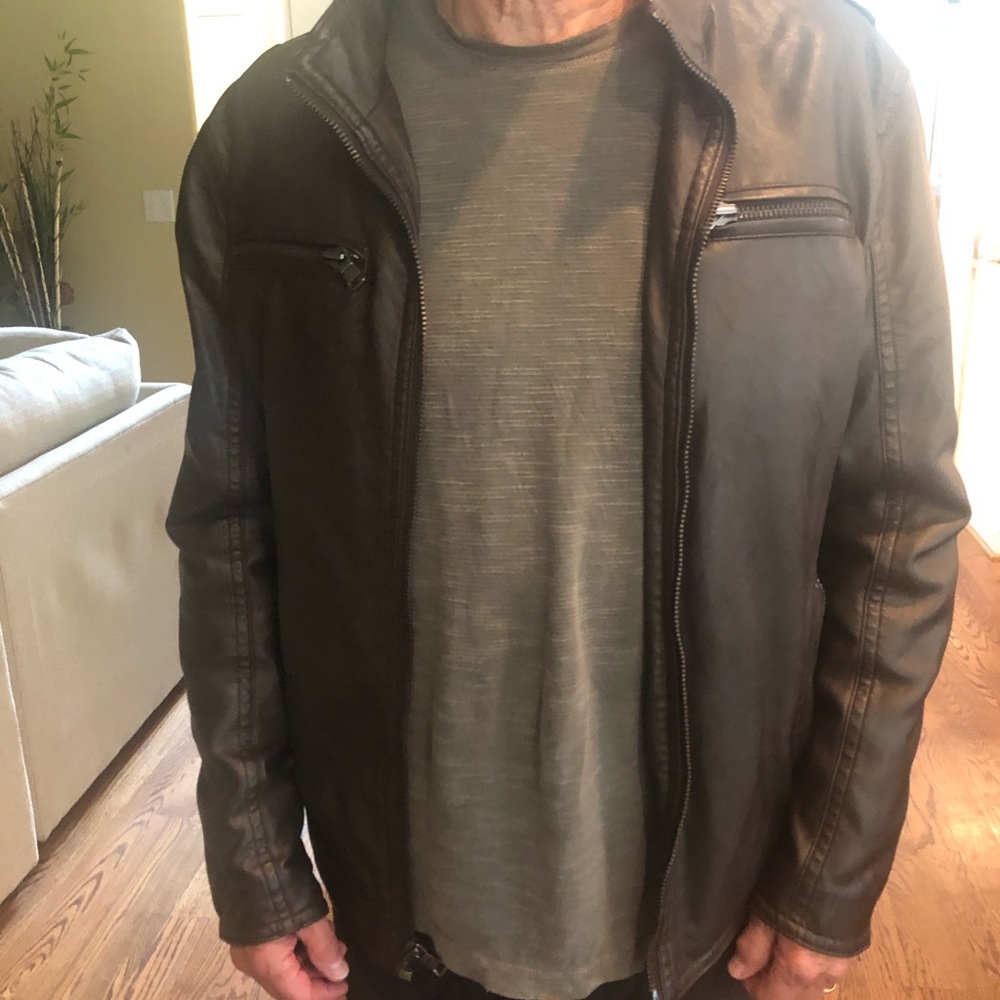 Brown leather jacket. Quilted brown satin.